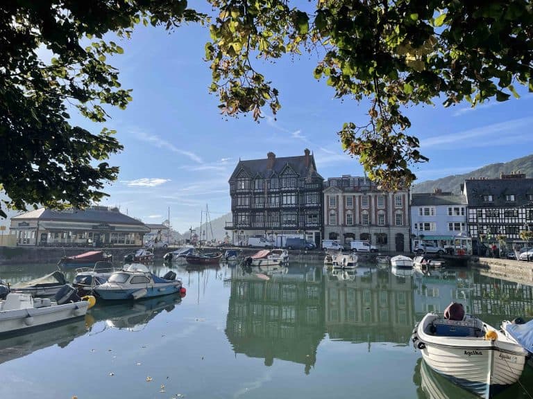 Reflections on Dartmouth boat float on autumn morning