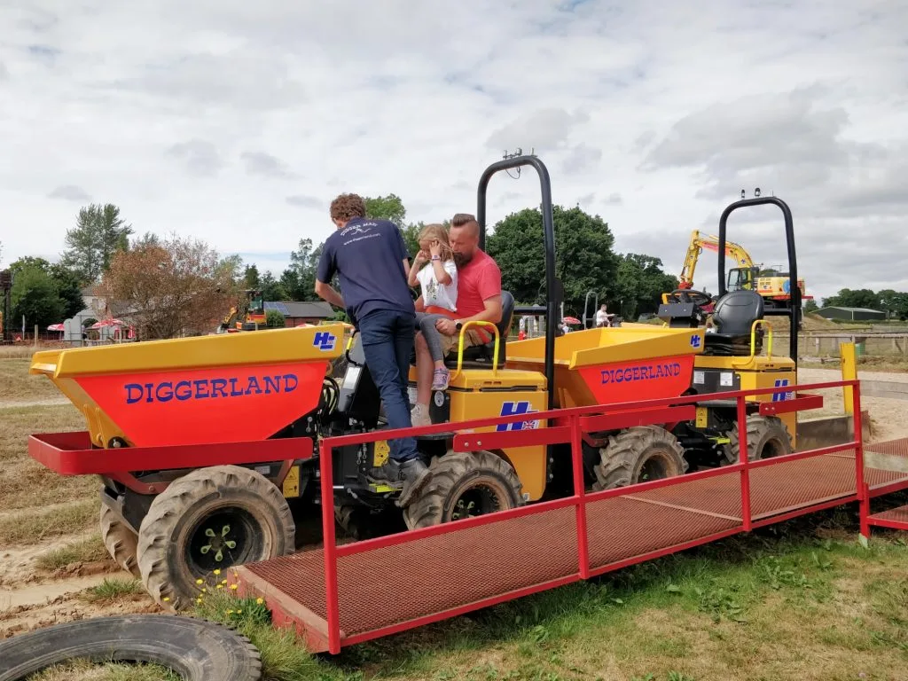 Family on dumper truck