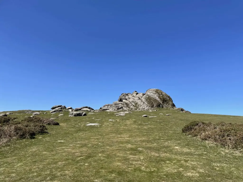 Haytor rocks on Dartmoor against a blue sky