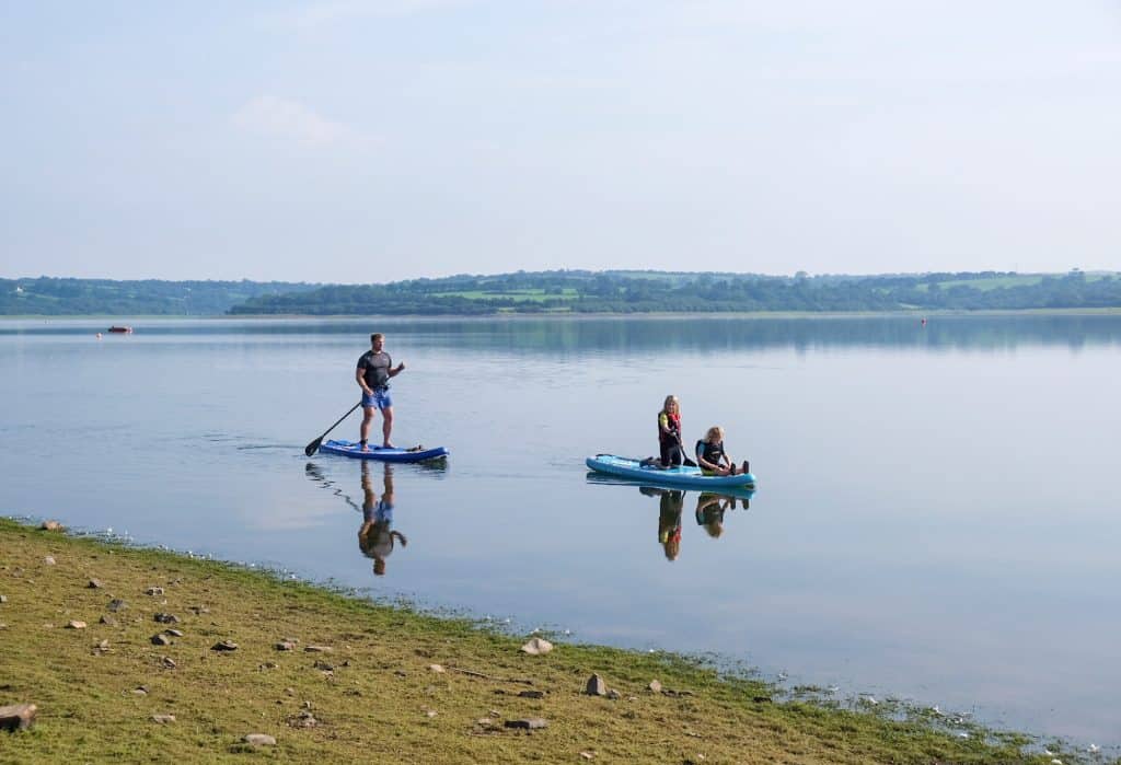 Paddle boarding on Roadford Lake in Devon