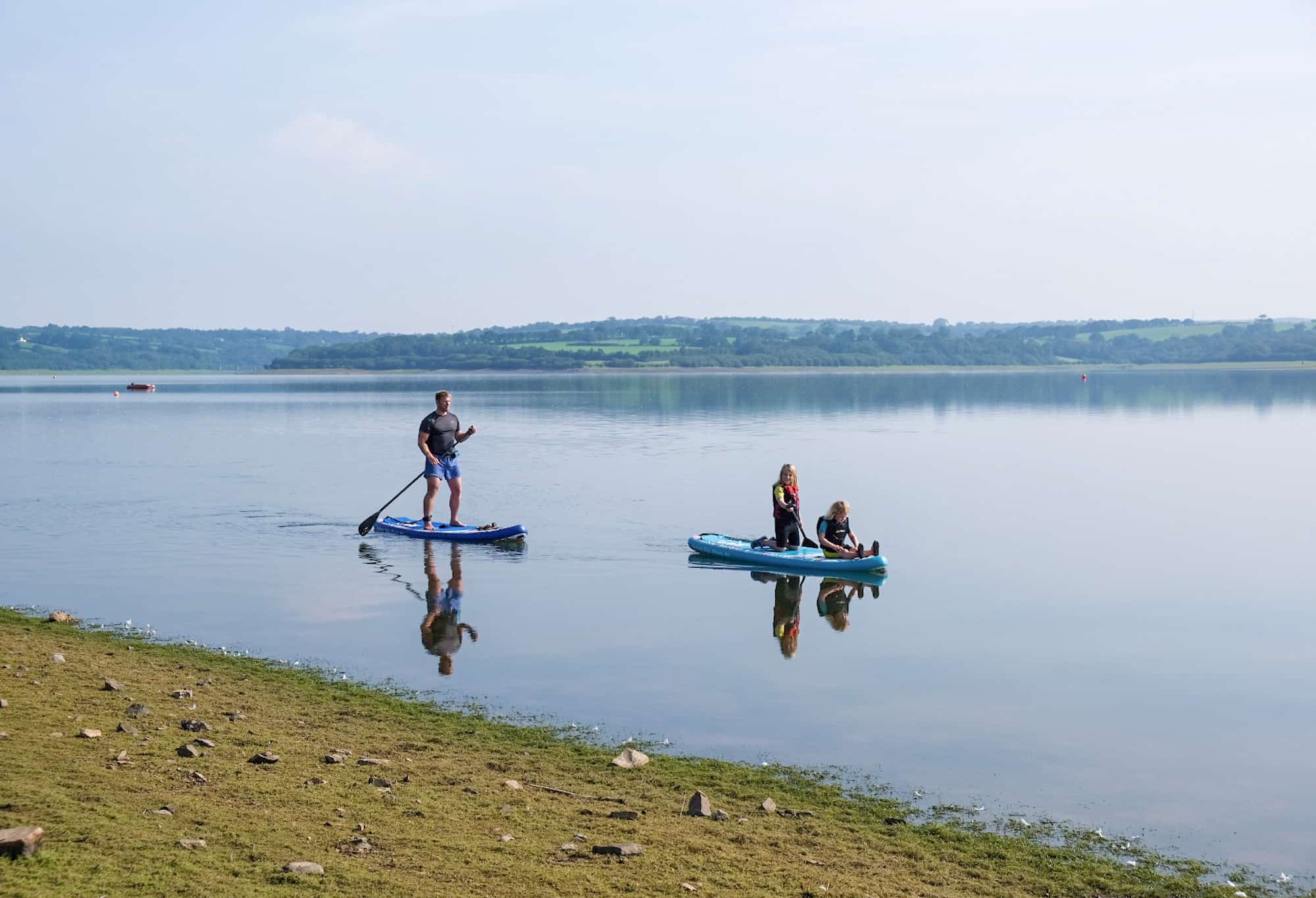 Paddle boarding on Roadford Lake in Devon