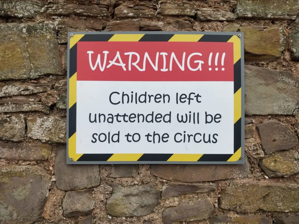 Sign warning that unattended children will be sold to the circus