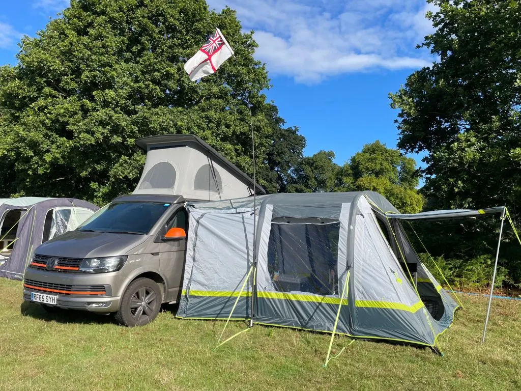 VW camper van and awning in camping field at Gone Wild Festival