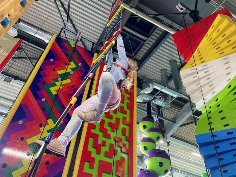 Child climbing rope ladder