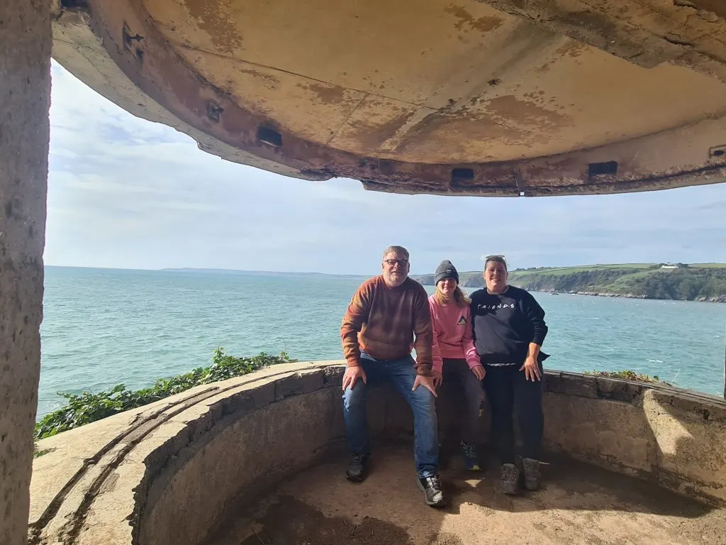 The Heath family in a searchlight building with view of South Devon coast