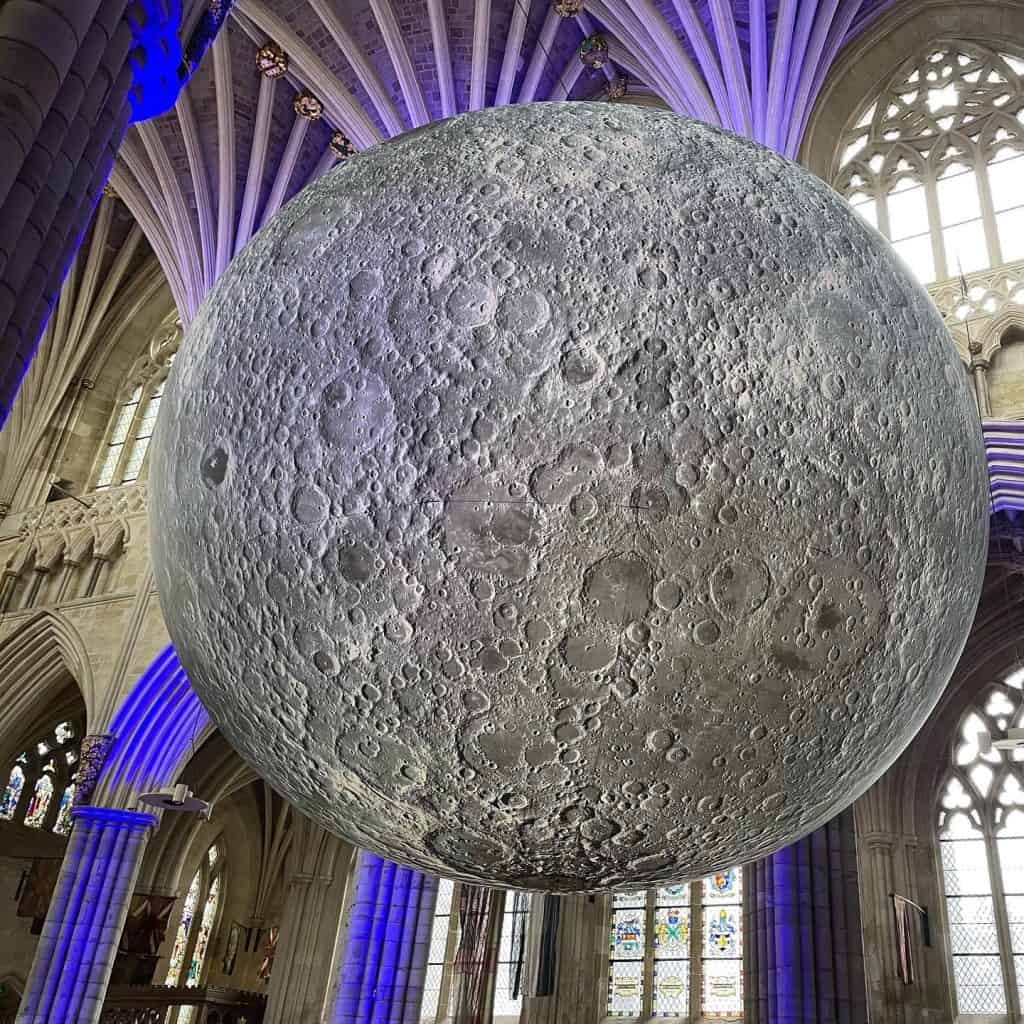 Globe with moon surface images hanging in the nave of Exeter Cathedral