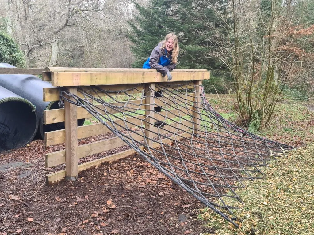 Teen on assault course at River Dart Country Park