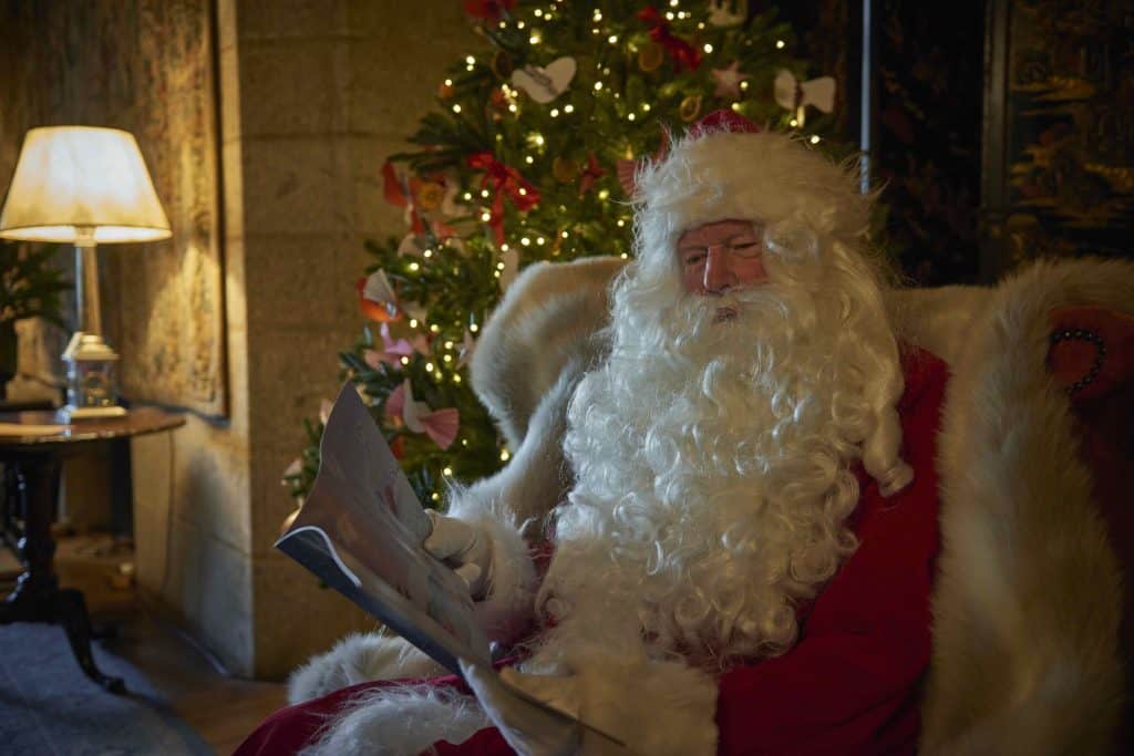 Father Christmas in the Library at Castle Drogo, Devon