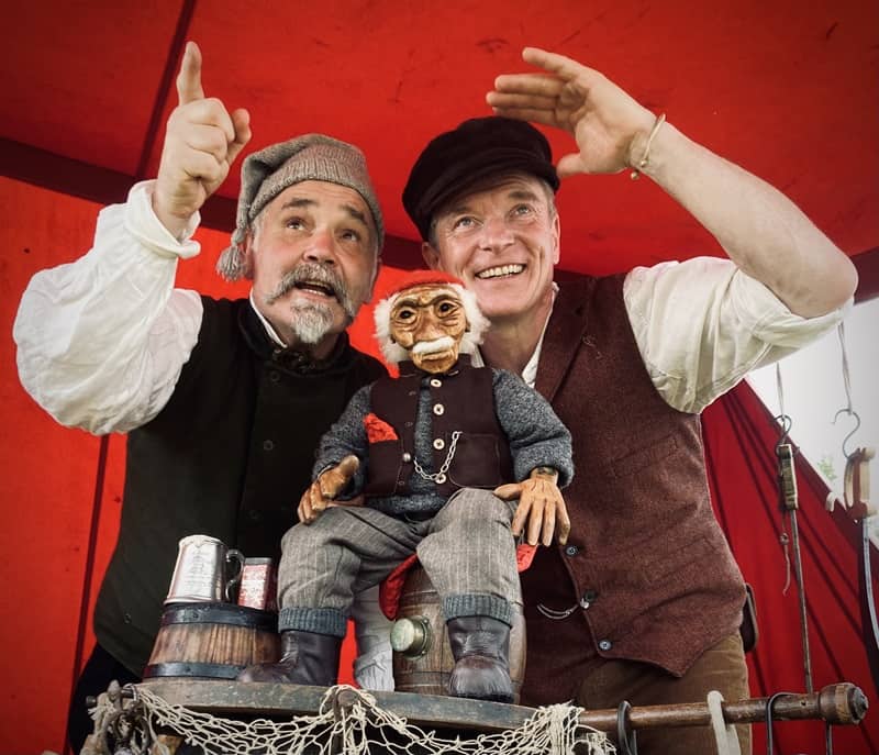 Actors dressed as pirates with a pirate puppet