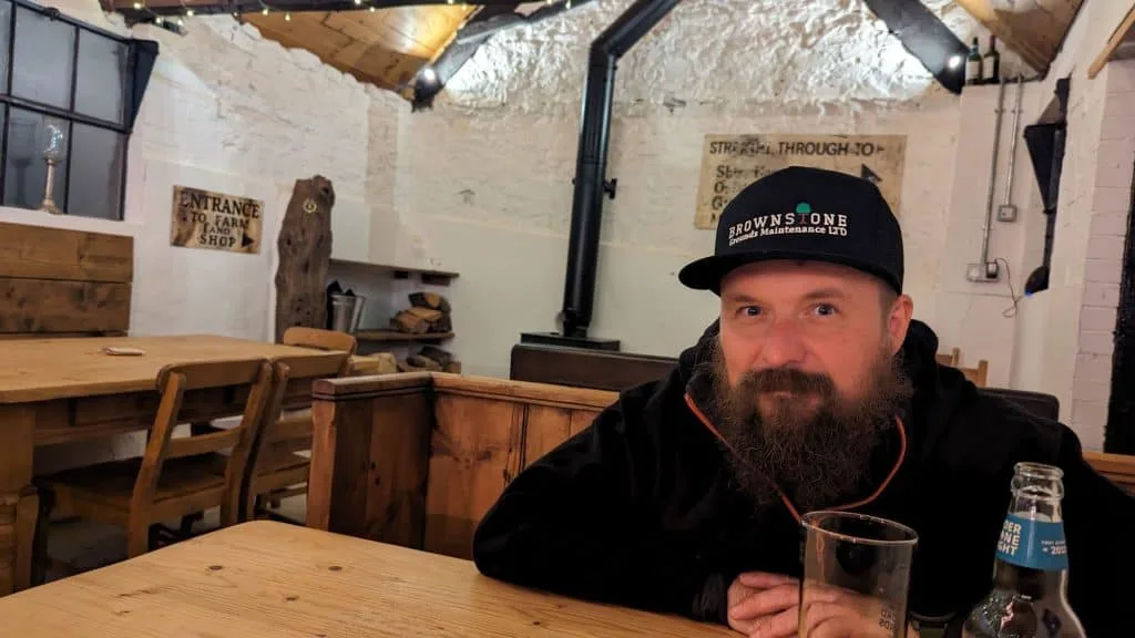 Stacey's husband enjoying a beer in the courtyard bar
