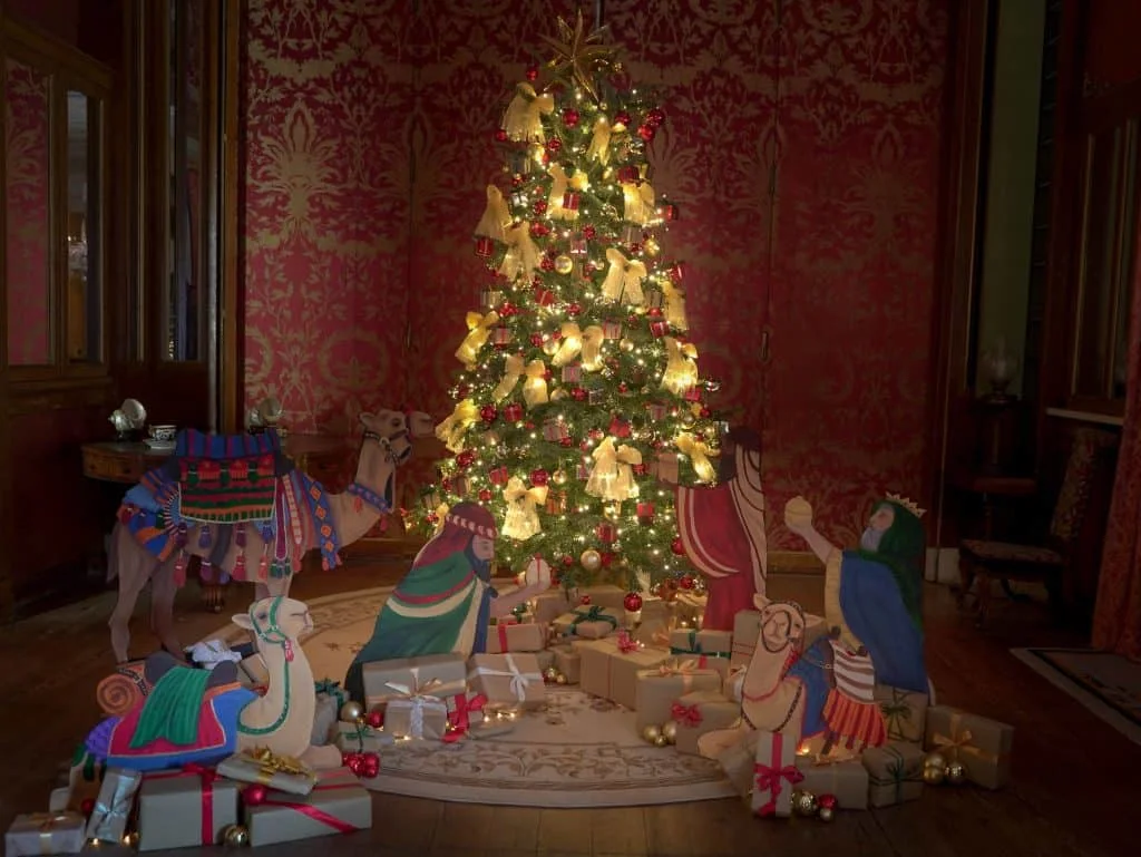 A Christmas tree illuminates a room in the historic house at Arlington Court