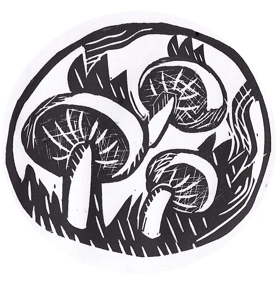 A print made with a rubber stamp. The print is a mushroom design