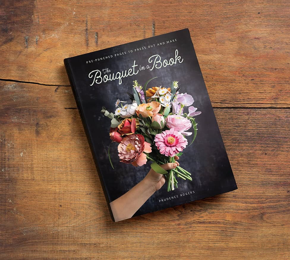 The Bouquet in a Book front cover on a wooden table