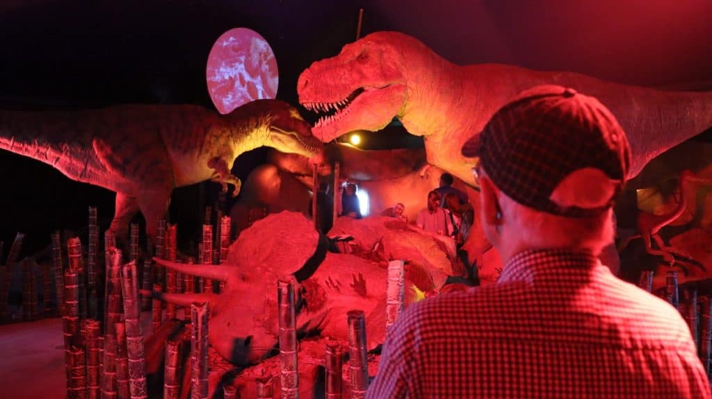T Rex dinosaur model stood over the body of its prey in an exhibition at Jurassic Discovery in Seaton