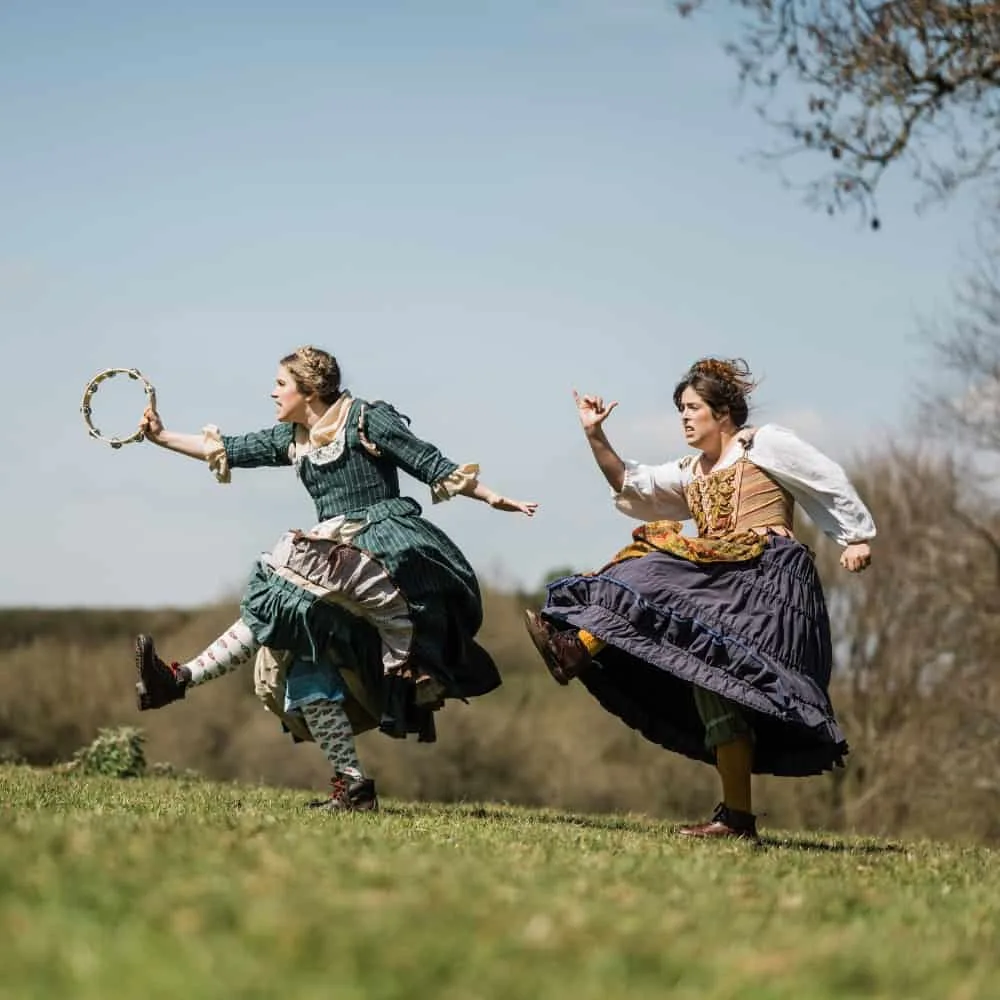 The Grimm Sisters skip through the countryside