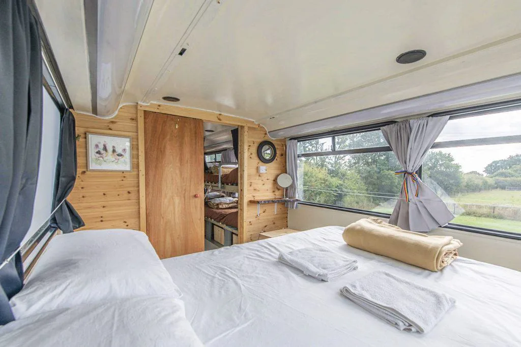 The master bedroom on the top deck of the glamping bus