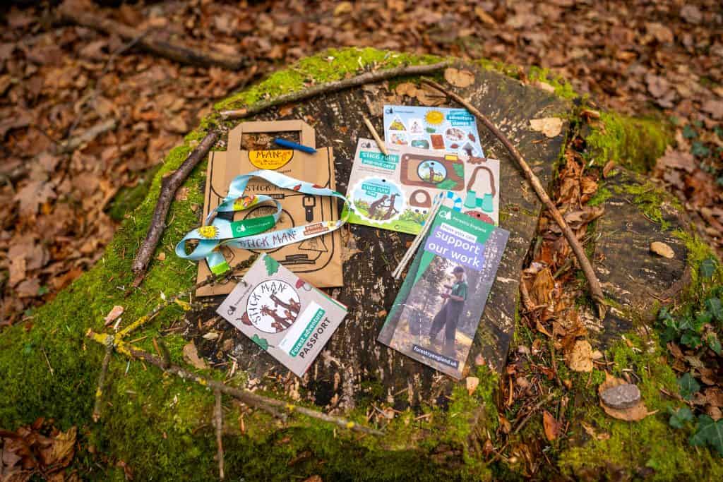 The contents of a Stick Man craft bag in the woods