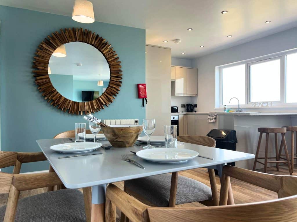 A sea-themed kitchen diner in the three bedroom hot tub apartment at North Devon Resort