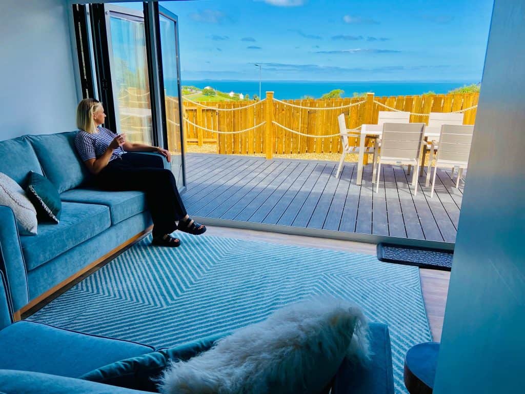 View out of the bi-fold doors of holiday apartment with sea view