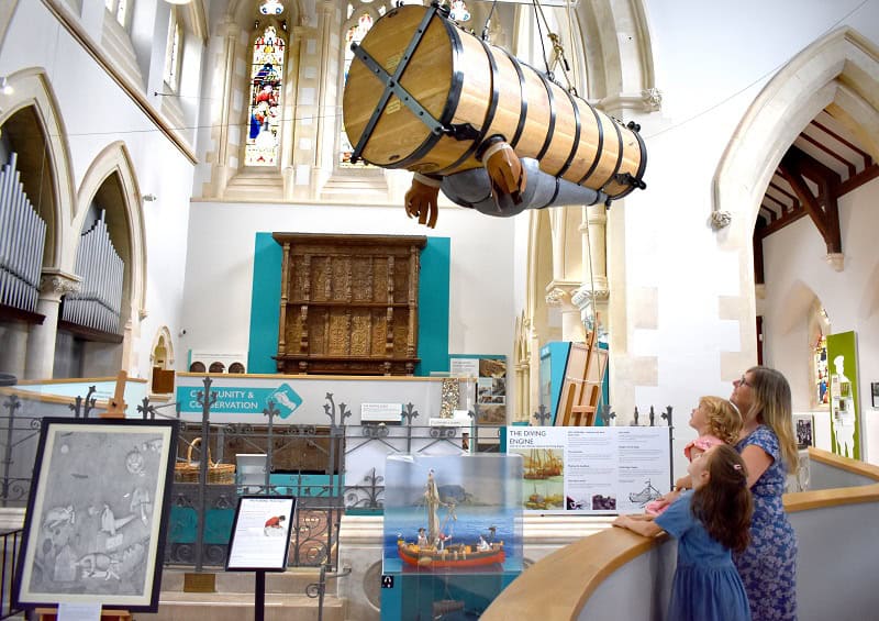 The inside of Newton Abbot Museum. A family is looking around