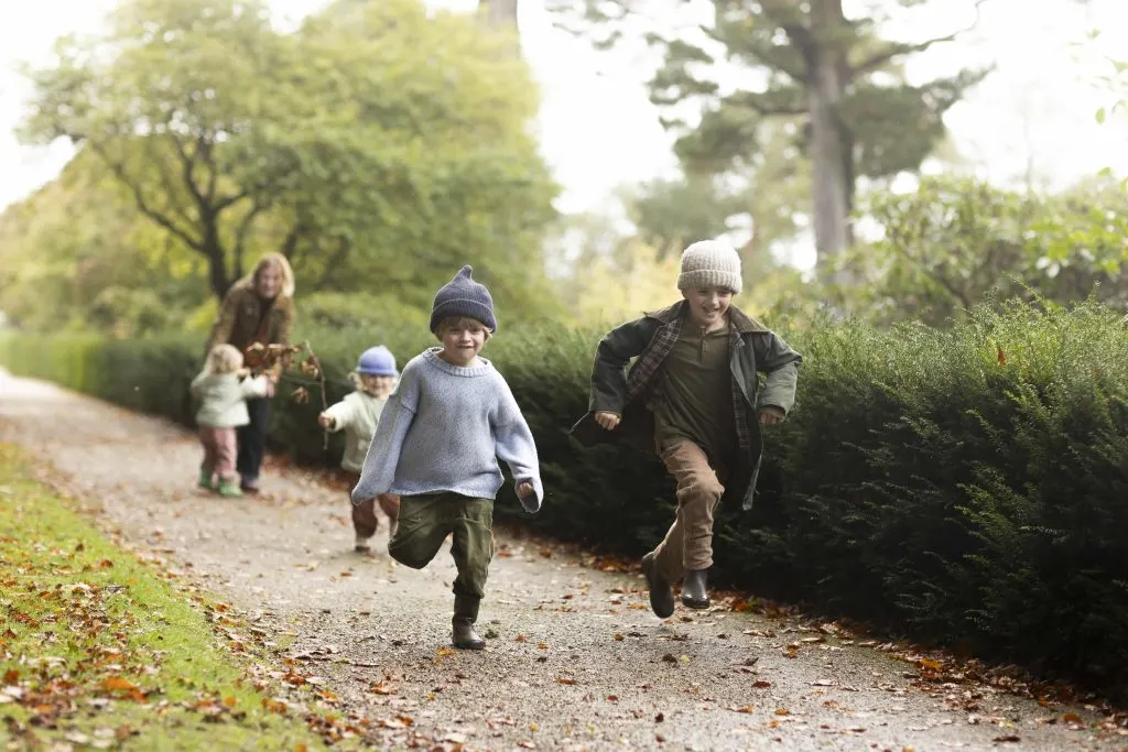 A family exploring the grounds at Castle Drogo, Devon, in October