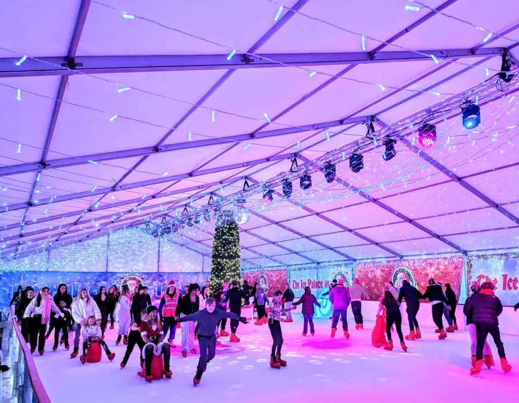 People skating on the ice rink at Plymouth's Winter Wonderland