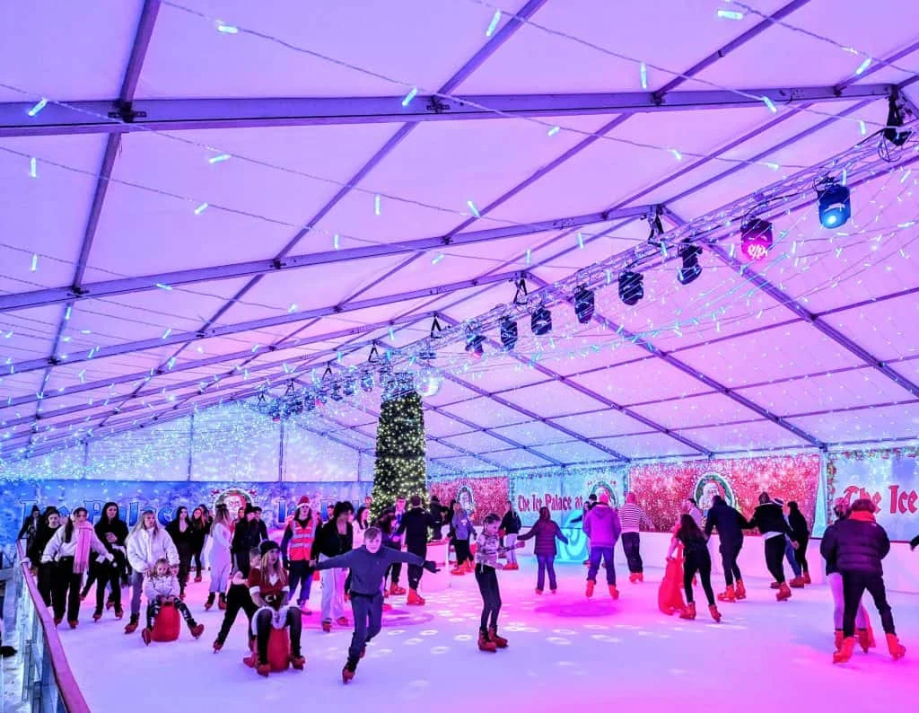 People skating on the ice rink at Plymouth's Winter Wonderland