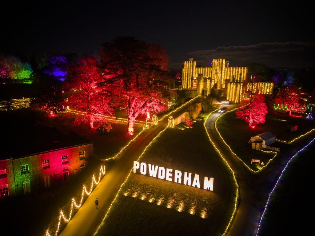 An overhead view of the castle and grounds at Powderham illuminated at night