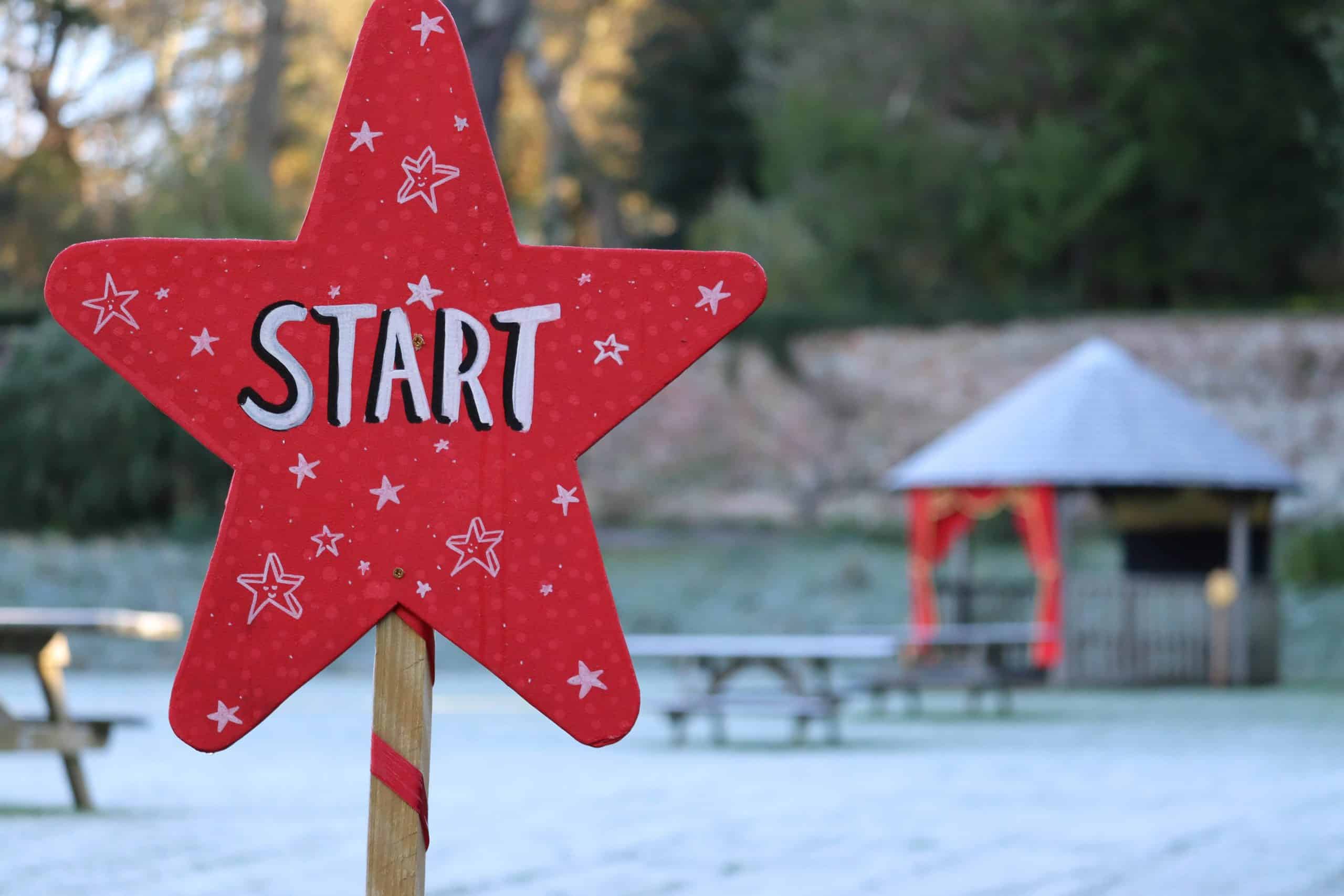 Red star shaped start sign for a Christmas trail at Greenway National Trust