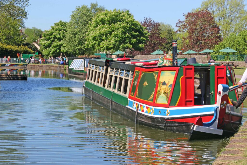 Colourful horse drawn barge on Tiverton Canal in Devon