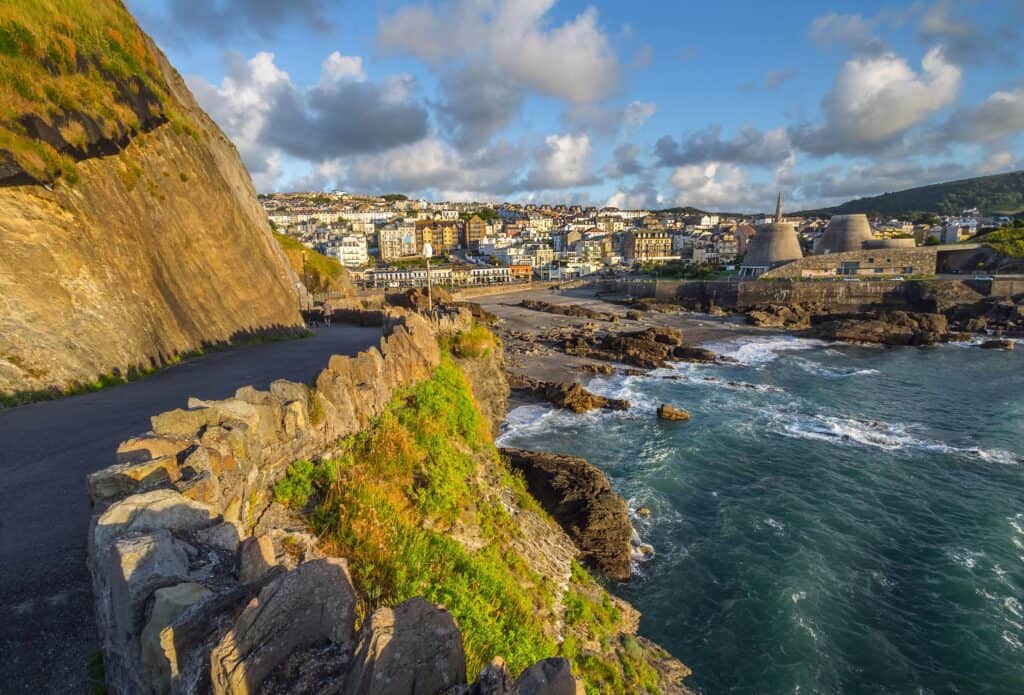 View of the town of Ilfracombe from Capstone Hill towards Wildersmouth Beach. Evening. Low tide at sea. North Devon. UK