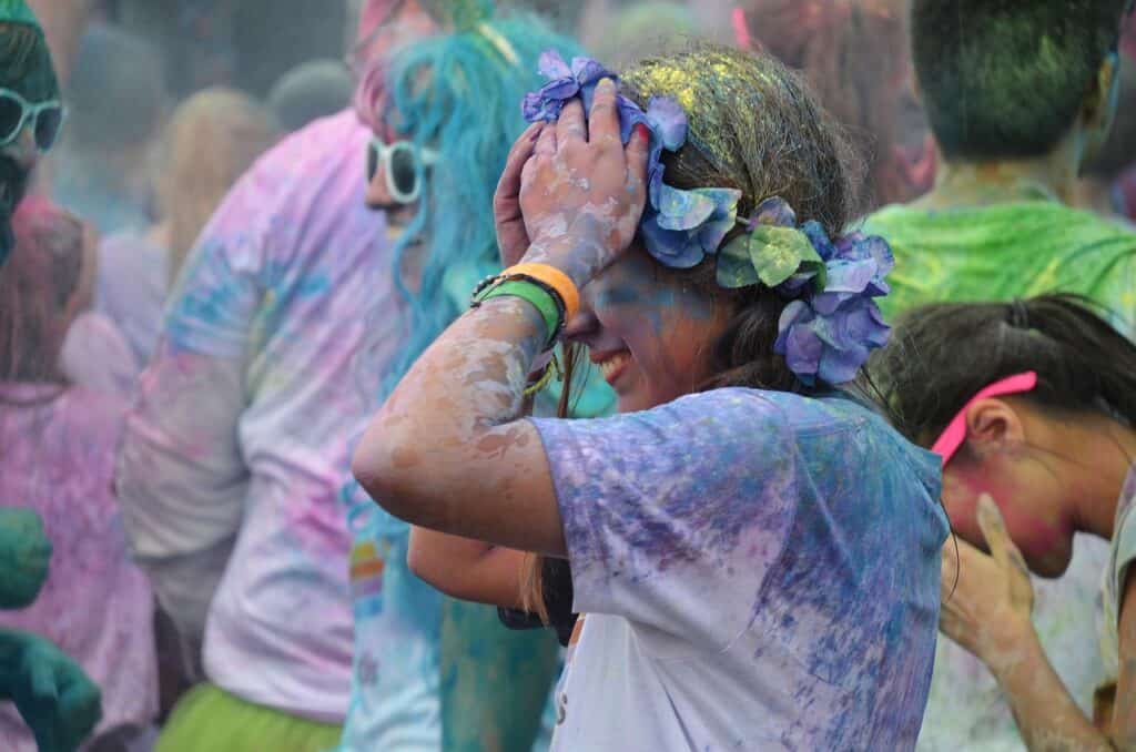 Children covered in paint pigment duirng RAMM's Colour Clash event