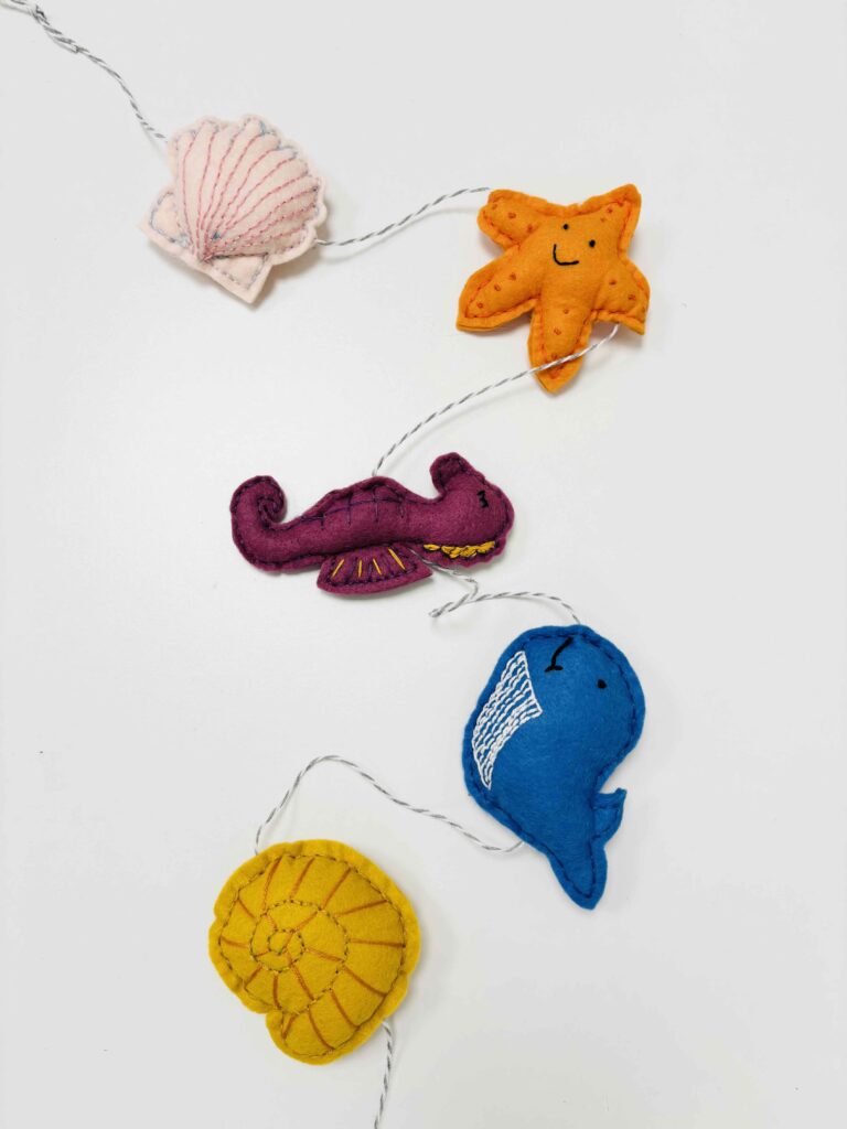 A handmade garland of sea creatures made from felt